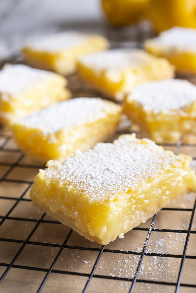 Lemon bars on a cooling rack.