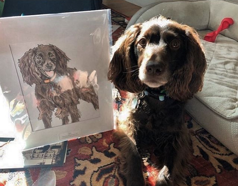 dog next to its custom portrait.