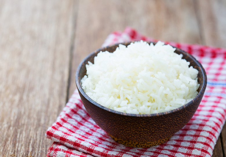 Jasmine rice in a  bowl on wood table