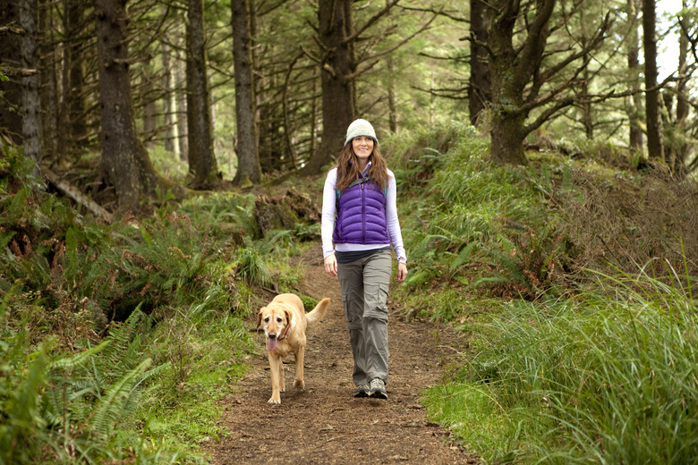 Female hiking with her dog.