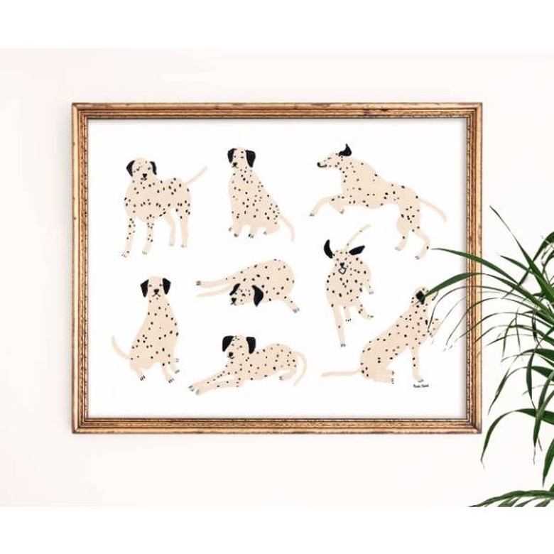 A framed print of Dalmation dogs in various poses