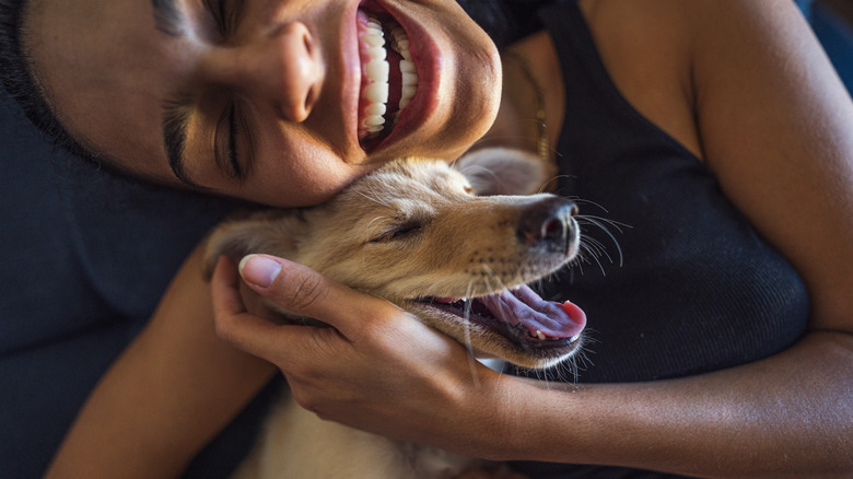 woman and dog smiling