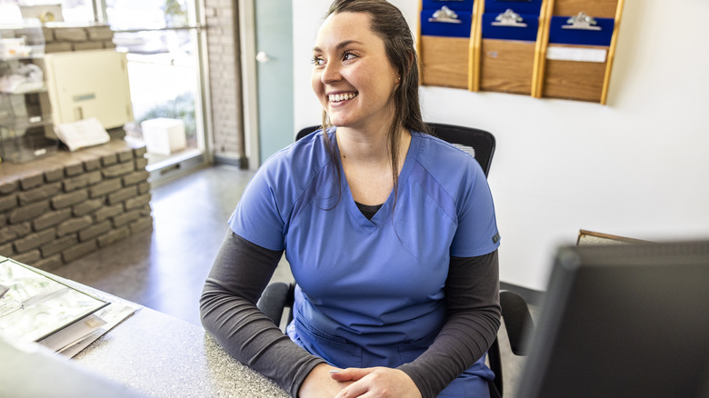 smiling office worker in a veterinary clinic