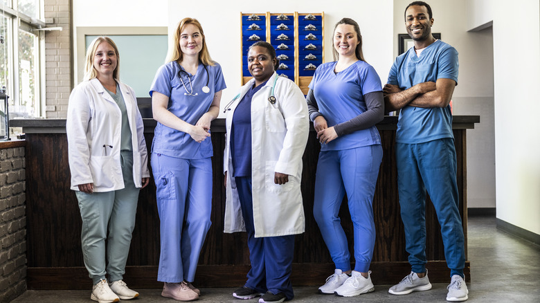 a smiling lineup of veterinarian clinic staff