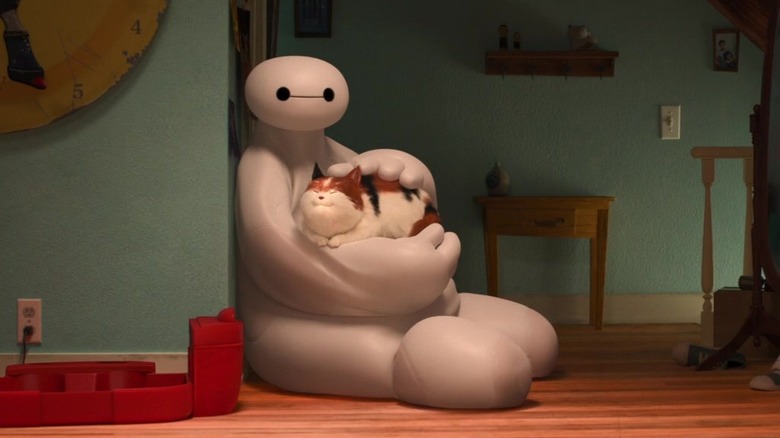 Baymax holds sleeping cat