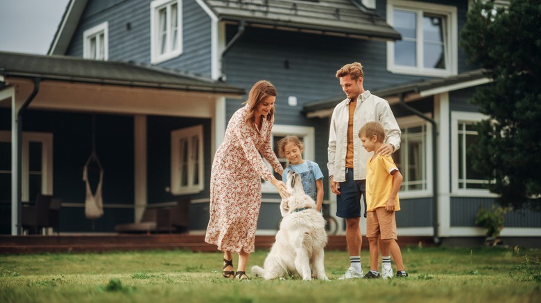 Family with golden retriever