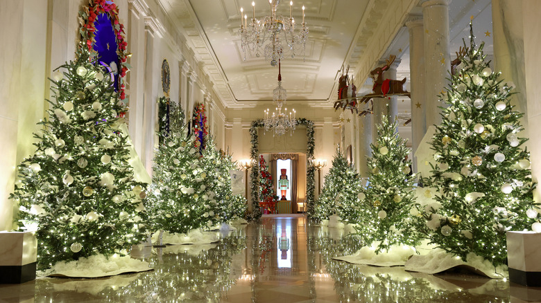 Christmas trees lining a hall in the White House in 2023