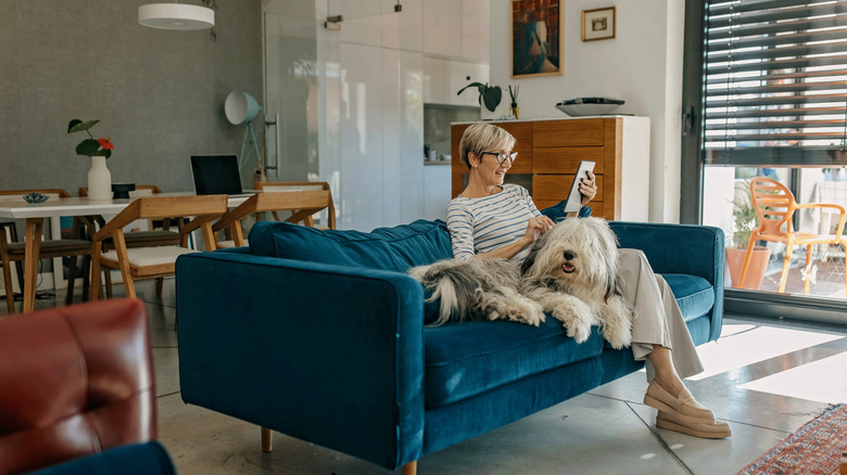 woman on couch with dog