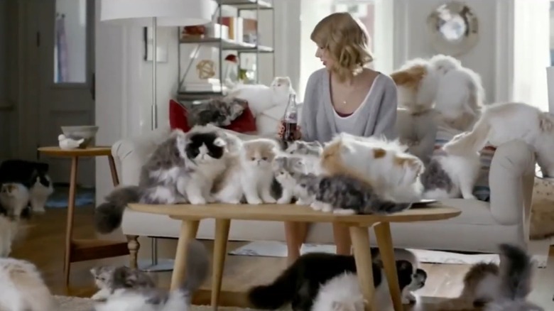 Taylor Swift in Diet Coke commercial with lots of cats