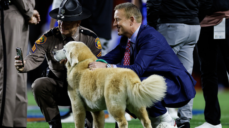 Kirk Herbstreit with dog, Ben, and police officer taking a selfie