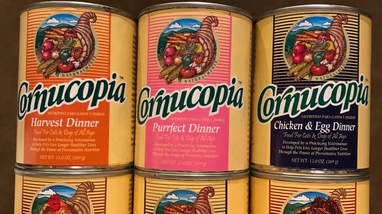 Cans of Cornucopia Express pet food stacked on top of each other