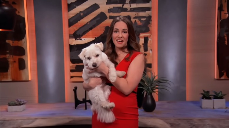 Kristen Brand holds Emma backstage after their appearance on "Shark Tank"